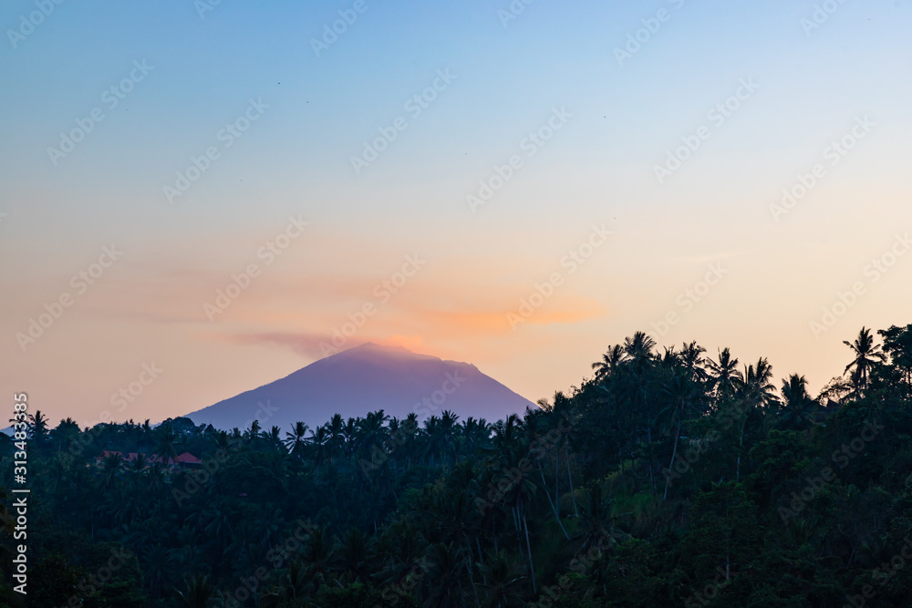 Mount Agung during sunrise view from Campuhan Ridge Walk, Ubud, Bali island, Indonesia.