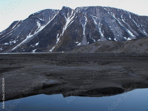 Perfect calm evening, the reflection at Summit Lake, Auyuittuq National park photo