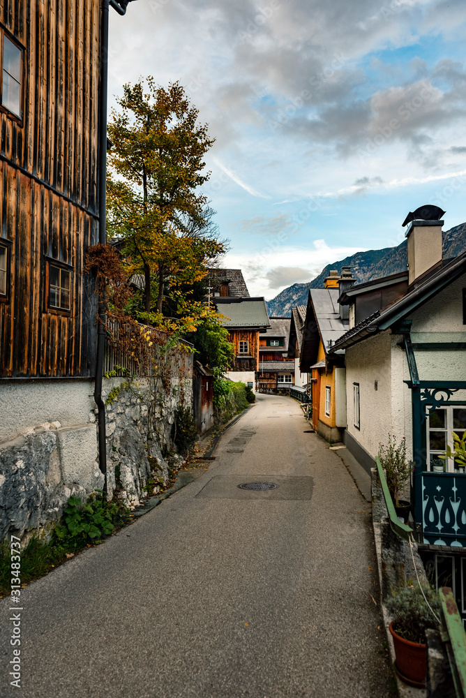 Narrow street in Hallstatt village  next to Hallstatter lake in Austrian Alps, Austria