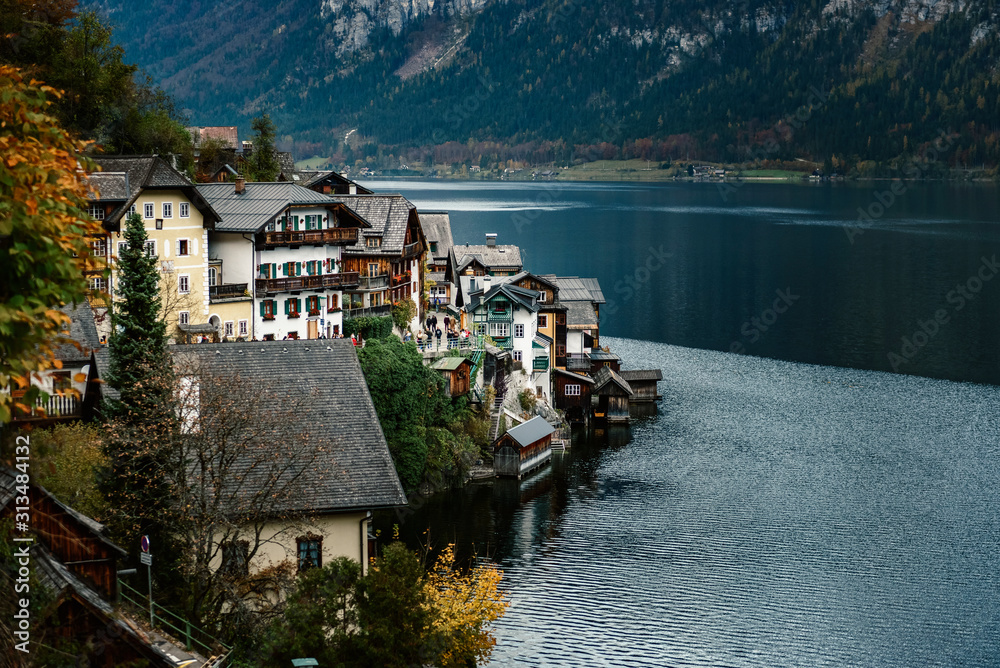 Hallstatt village buildings built on a steep mountain next to   Hallstatter lake in Austria, Alp region
