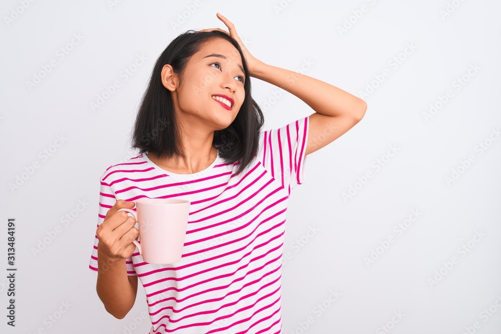 Young beautiful chinese woman drinking cup of coffee over isolated white background stressed with hand on head, shocked with shame and surprise face, angry and frustrated. Fear and upset for mistake. Young beautiful chinese woman drinking cup of coffee over isolated white background stressed with hand on head, shocked with shame and surprise face, angry and frustrated. Fear and upset for mistake.