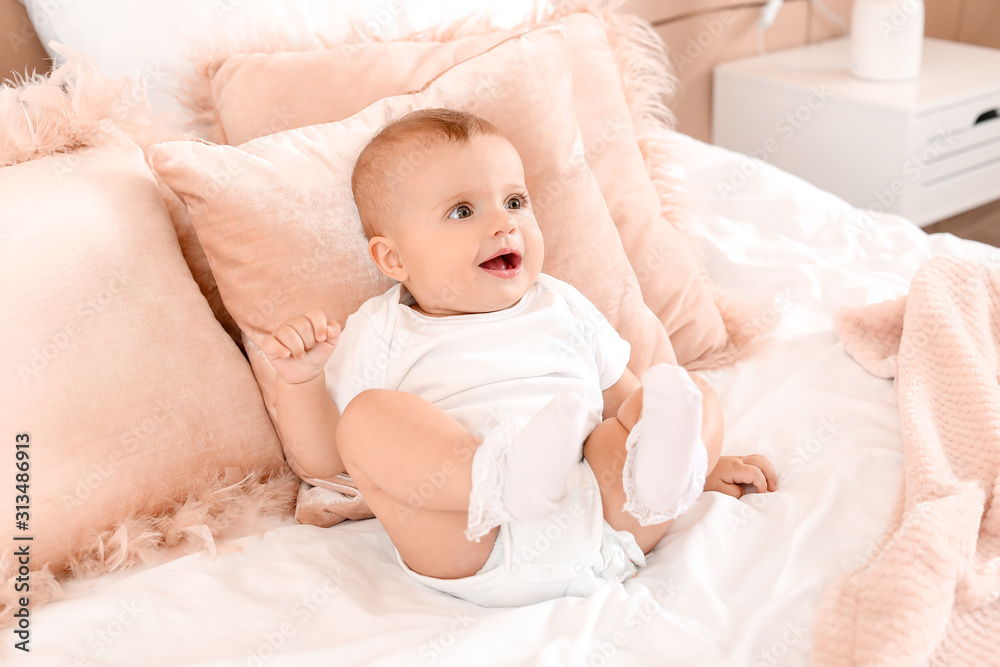 Portrait of cute little baby on bed at home Portrait of cute little baby on bed at home