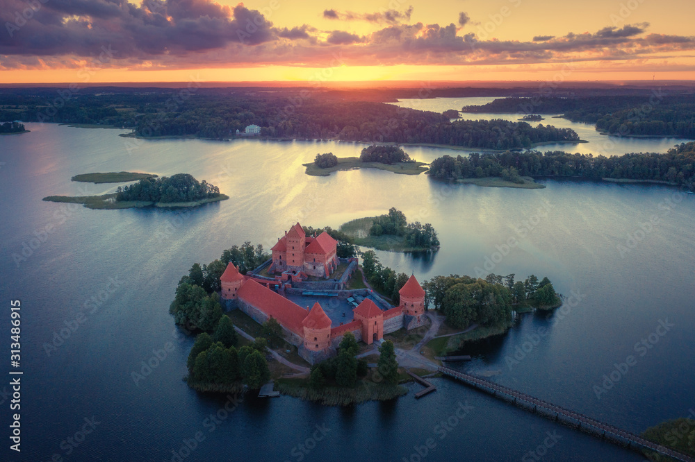 Sunset over old castle Trakai in Lithuania, aerial view. Summer landscape castle Trakai