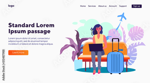 Young woman with laptop waiting her flight