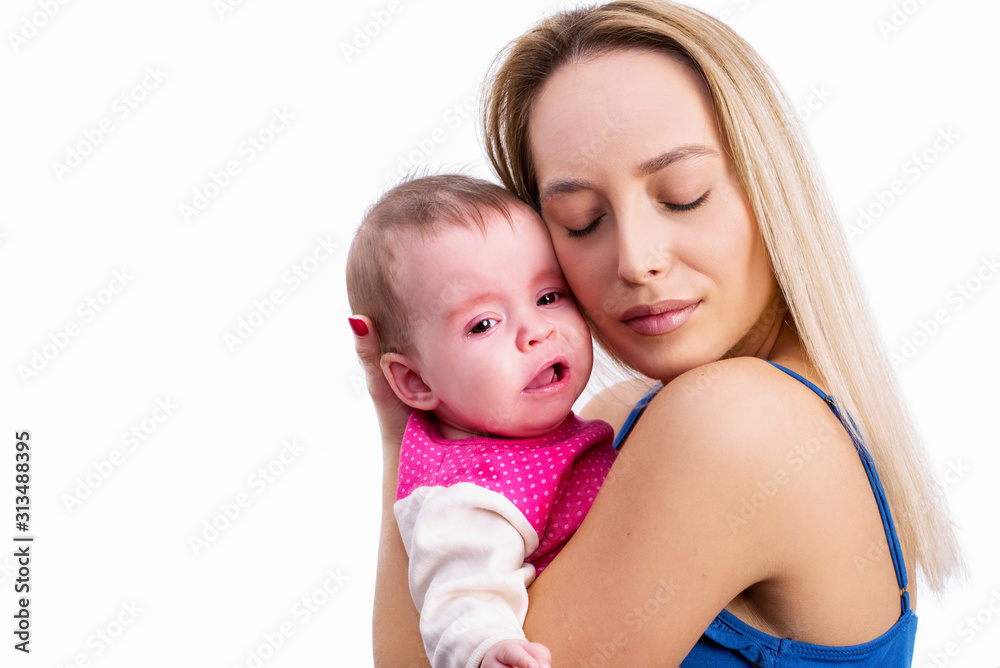 Mother hugging crying baby girl Mother hugging crying baby girl