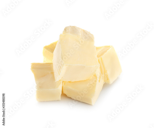 Pieces of fresh butter on white background
