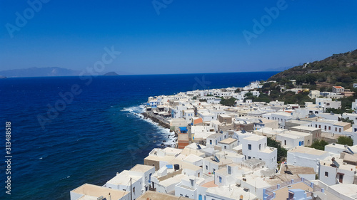 Fototapeta Naklejka Na Ścianę i Meble -  View of small town,look down on white houses on greek island Nisyros, Greece 