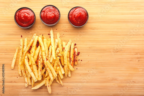 French fries with red dippi...