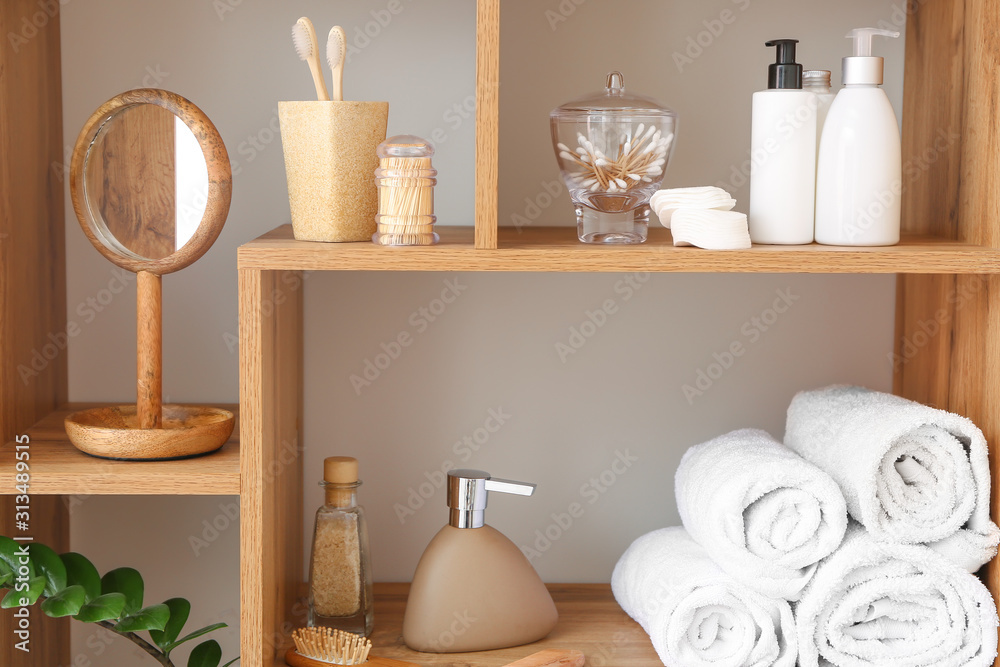 Body care cosmetics with accessories on shelves in bathroom Body care cosmetics with accessories on shelves in bathroom