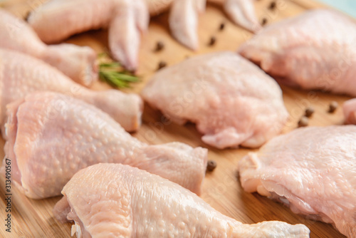 Raw chicken meat on wooden background, closeup
