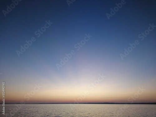 Clear sky, evening sunset on a lake in Karelia.