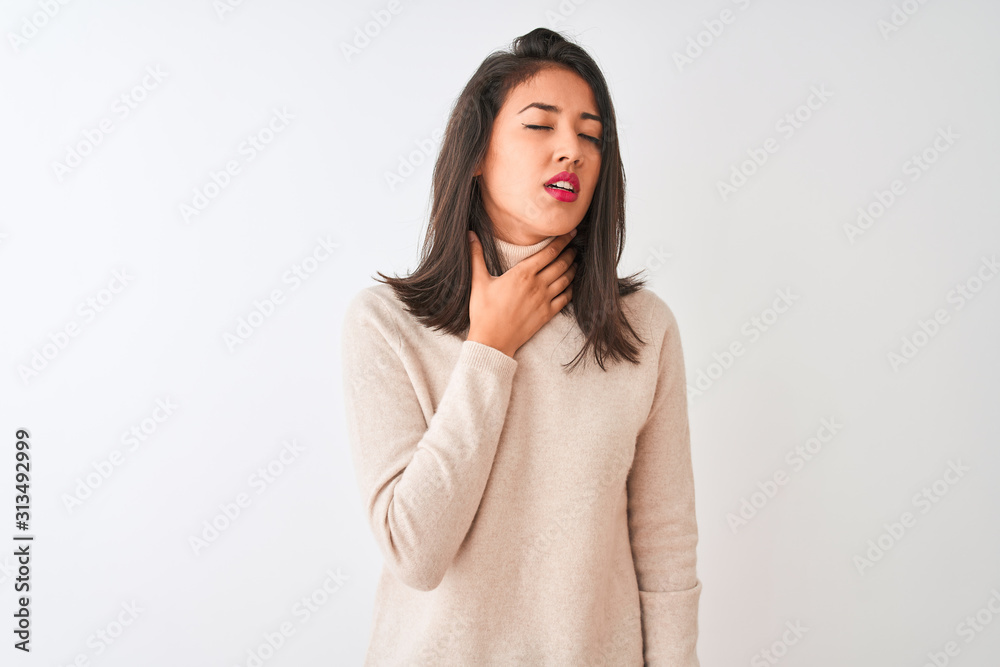 Beautiful chinese woman wearing turtleneck sweater standing over isolated white background Touching painful neck, sore throat for flu, clod and infection Beautiful chinese woman wearing turtleneck sweater standing over isolated white background Touching painful neck, sore throat for flu, clod and infection