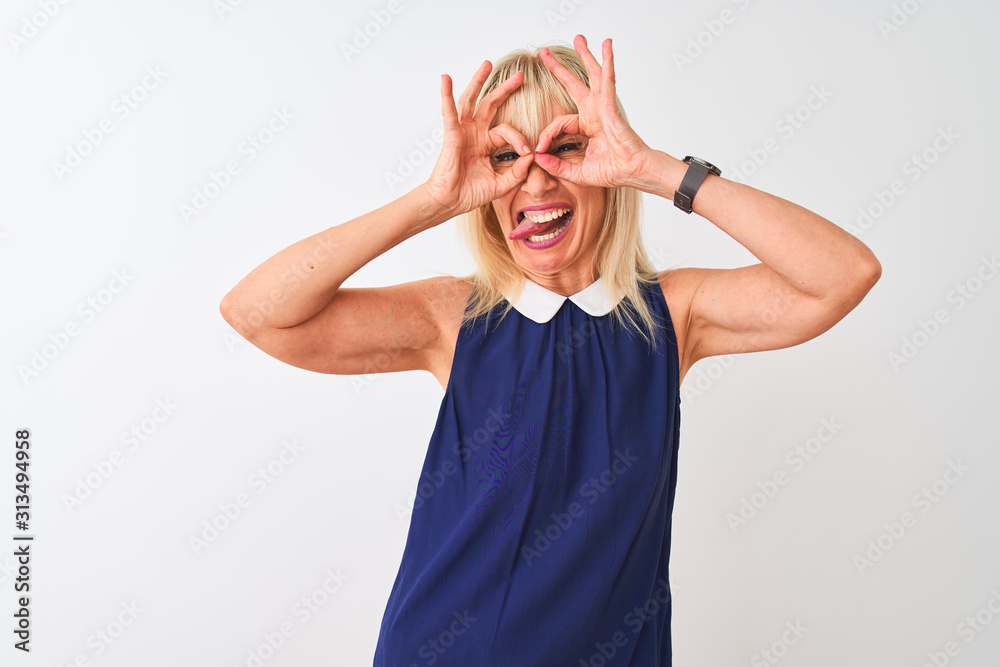 Φωτογραφία Middle age woman wearing elegant blue dress standing over isolated white background doing ok gesture like binoculars sticking tongue out, eyes looking through fingers