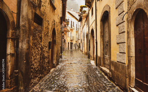 Old street whit ancient building and stone paved road in Rome city center  Italy.