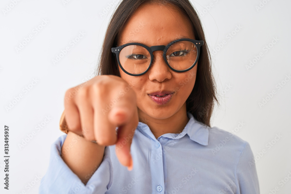 Young chinese woman wearing shirt and glasses standing over isolated white background pointing with finger to the camera and to you, hand sign, positive and confident gesture from the front Young chinese woman wearing shirt and glasses standing over isolated white background pointing with finger to the camera and to you, hand sign, positive and confident gesture from the front