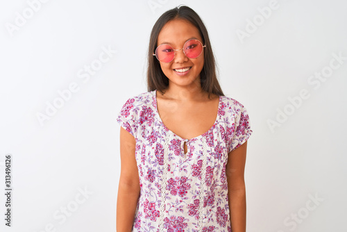 Young chinese woman wearing floral t-shirt and pink glasses over isolated white background with a happy and cool smile on face. Lucky person. © Krakenimages.com