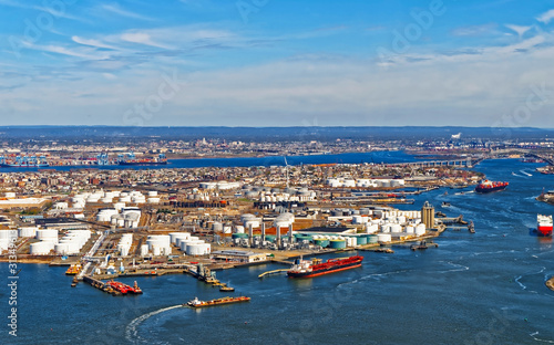 Aerial view of Dry Dock and Repair and Port Newark and Global international shipping containers, Bayonne, New Jersey. NJ, USA. Harbor cargo. Staten Island with St George Ferry terminal, New York City photo