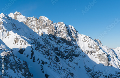 Snowy mountain peaks Austrian Alps on a clear blue sunny day