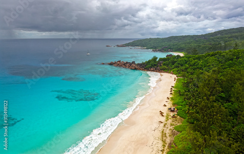 Landscape Seychelles Island La Digue in Indian ocean, beautiful blue sea with waves, sand beaches and green forest in the tropical paradise. Travel pictures