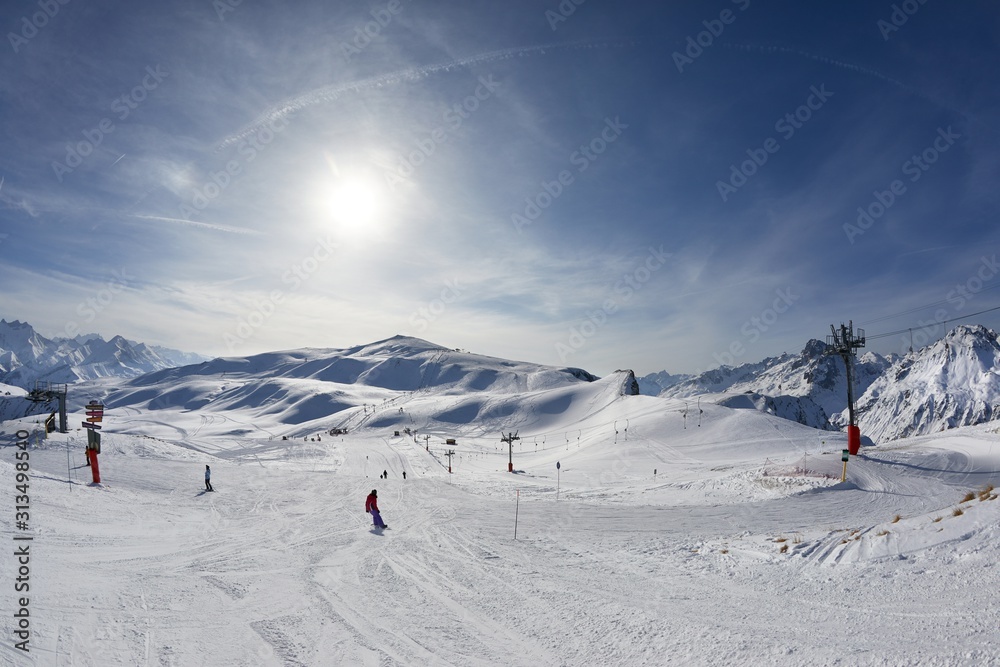 Skiing in the French Alpes, snowy high mountain landscape