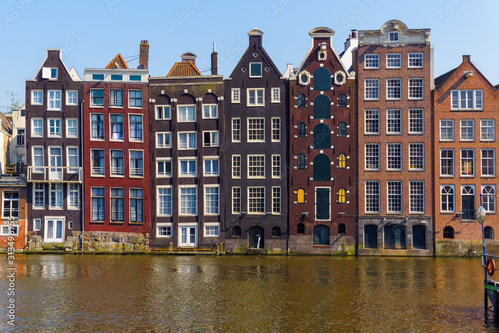 Traditional Dutch buildings at Damrak in Amsterdam, Netherlands