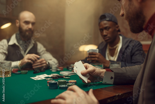 Male player cheating in poker photo