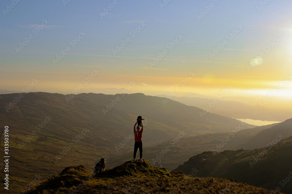 silhouette of man on top of mountain (lion king)