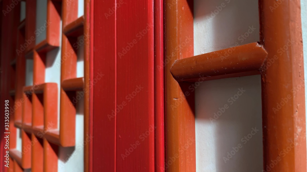 Red wooden carved decorative doors in chinese style, asian traditional ornament for decorating home, walls and doors