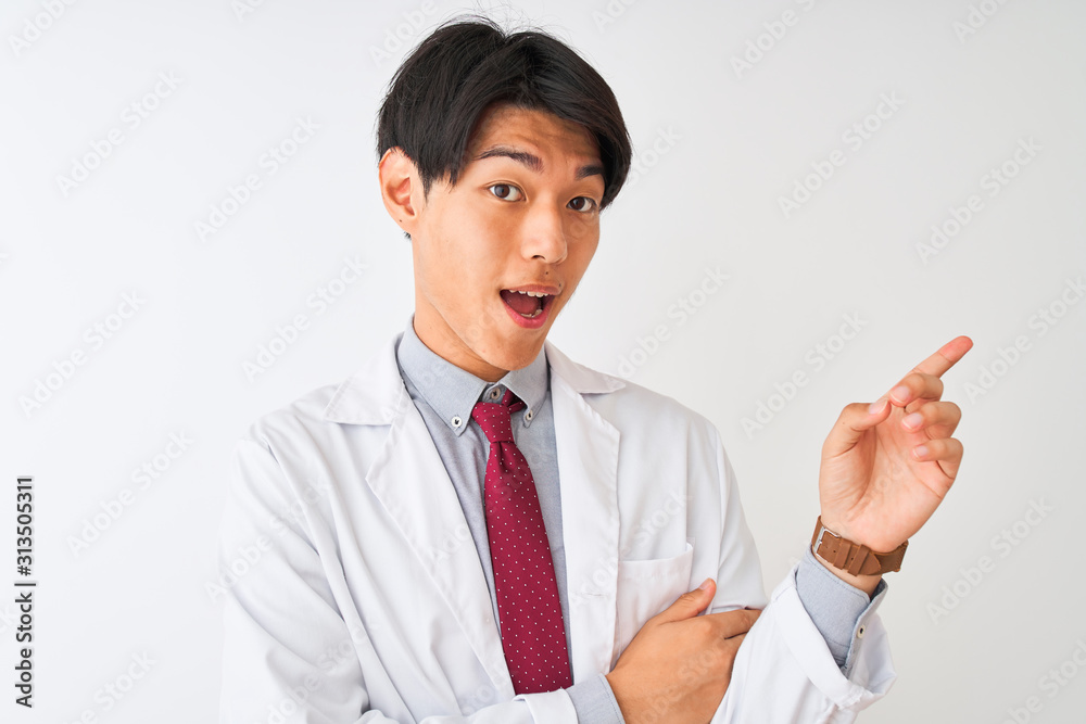 Chinese scientist man wearing tie and coat standing over isolated white background with a big smile on face, pointing with hand and finger to the side looking at the camera. Chinese scientist man wearing tie and coat standing over isolated white background with a big smile on face, pointing with hand and finger to the side looking at the camera.
