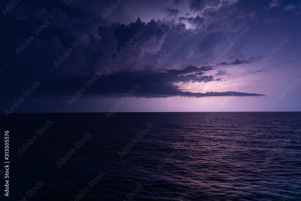 Storm weather with lighting at open sea