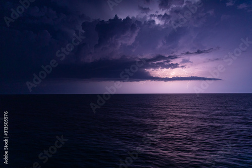 Storm weather with lighting at open sea