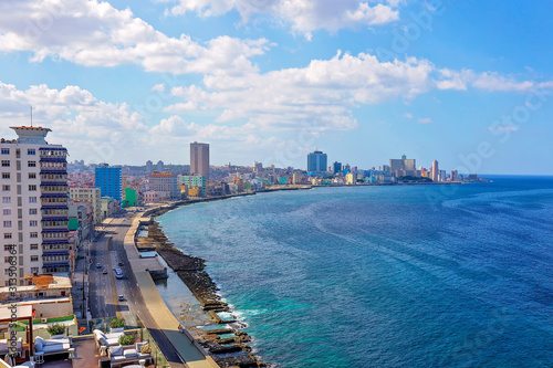 EL Malecon (Avenida de Maceo), a broad landmark esplanade that stretches for 8 km along the coast in Havana past major city tourist attractions © eskystudio
