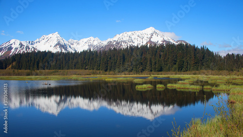 Fototapeta Naklejka Na Ścianę i Meble -  Mt Benson and the Kenai Mountains reflected in Salmon Creek - Seward, Alaska
