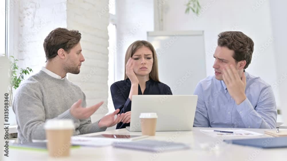 Disappointed Creative Team Reacting to Failure on Laptop Disappointed Creative Team Reacting to Failure on Laptop