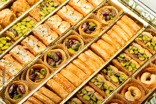 Oriental sweets in the box. Baklava with pistachios