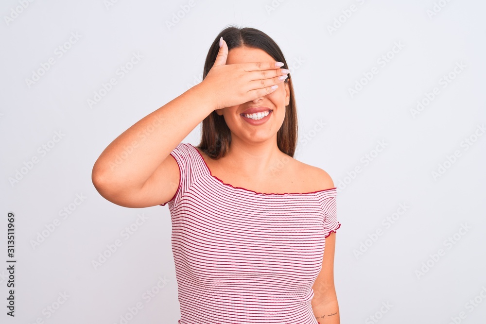 Portrait of beautiful young woman standing over isolated white background smiling and laughing with hand on face covering eyes for surprise. Blind concept. Portrait of beautiful young woman standing over isolated white background smiling and laughing with hand on face covering eyes for surprise. Blind concept.