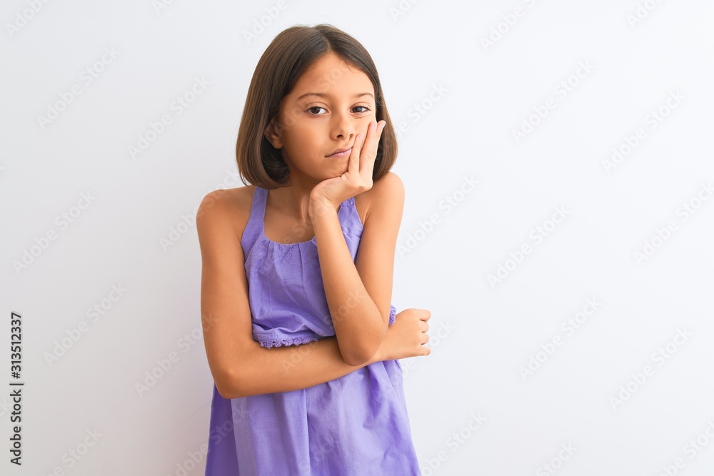Young beautiful child girl wearing purple casual dress standing over isolated white background thinking looking tired and bored with depression problems with crossed arms. Young beautiful child girl wearing purple casual dress standing over isolated white background thinking looking tired and bored with depression problems with crossed arms.