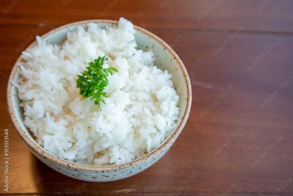 Small bowl of white rice with vegetable decorated on top. Small bowl of white rice with vegetable decorated on top.