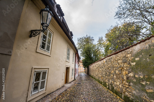 Novy Svet Street  an empty picturesque cobblestone medieval and narrow street of Hradcany hill in Prague  Czech Republic  with medieval houses and trees. It is a major touristic attraction