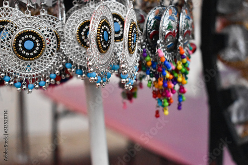 Colourful ethnic earrings selling at market stall