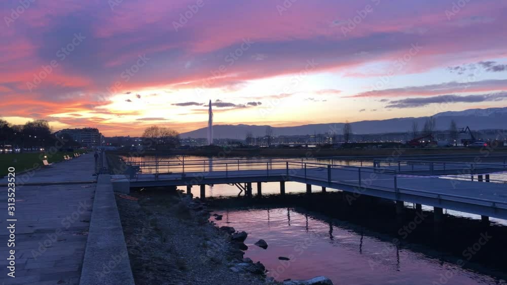 Sunset pan shot from the Geneva boat pontoon, jet d'eau in the background Sunset pan shot from the Geneva boat pontoon, jet d'eau in the background