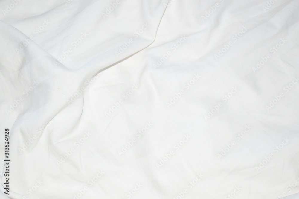 The surface of the bed sheet is crumpled.