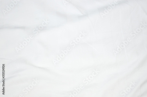 The surface of the bed sheet is crumpled.