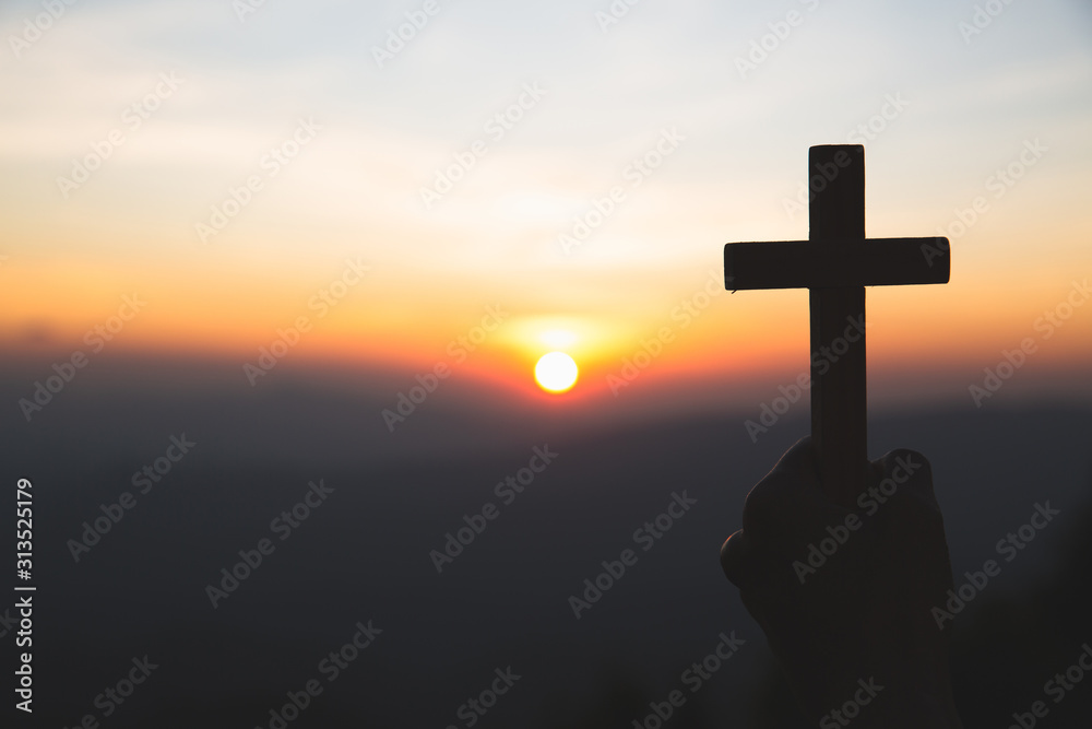 The hand holding the cross.The symbol of the blessing of Jesus.A symbol of pleading and faith.The symbol of the cross with the sunshine in the sky. Have space to enter text.