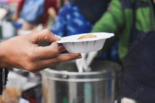 Serving panipuri in the market food stall