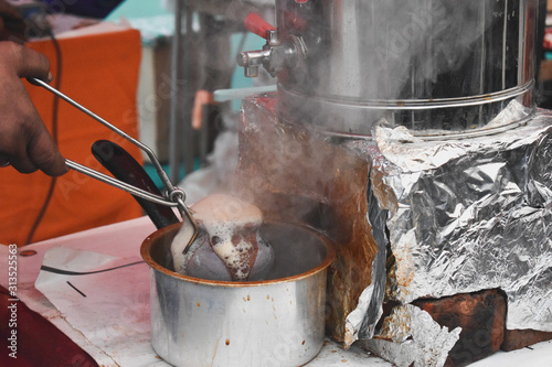 Making tandoori tea in a clay pot