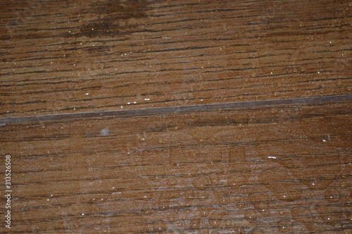 The surface of the floor in the bathroom with water droplets