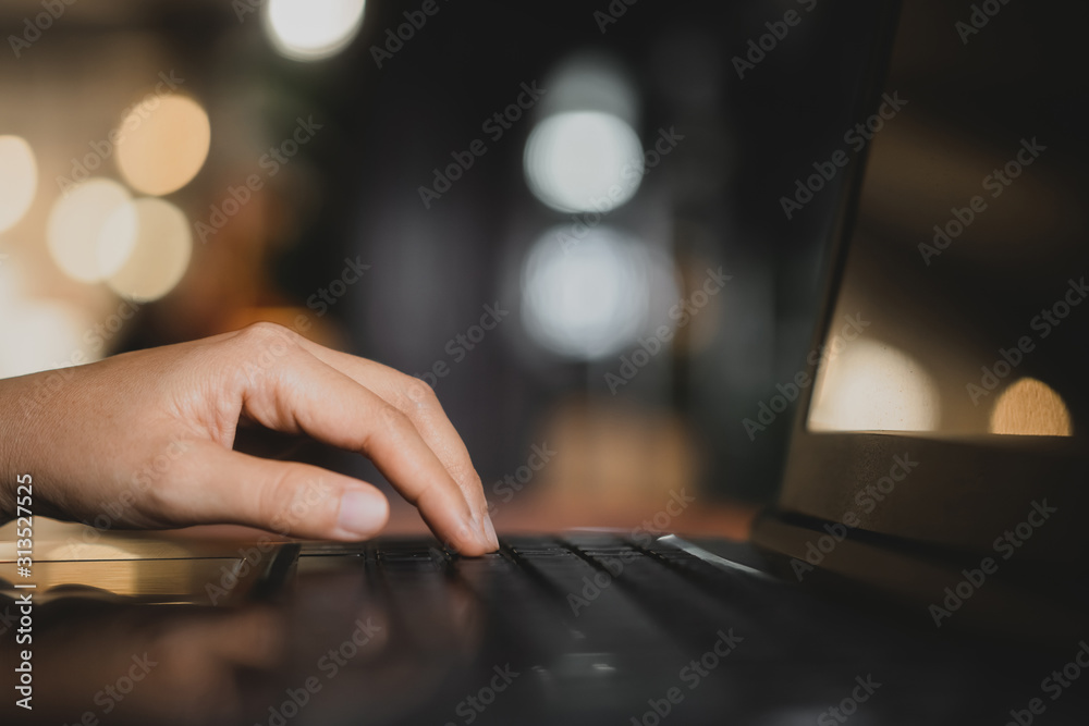 Woman hand using keyboard laptop on wood table in coffee shop. Woman hand using keyboard laptop on wood table in coffee shop.