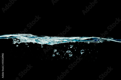 water wave isolated on black background.