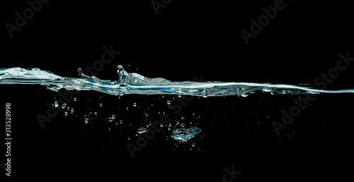 water wave isolated on black background.